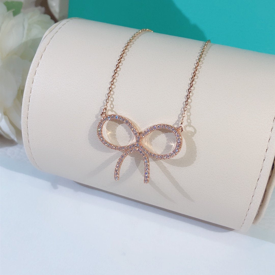 [Hevara Jewelry]CLAW SET RHODIUM PLATED BOW NECKLACE
