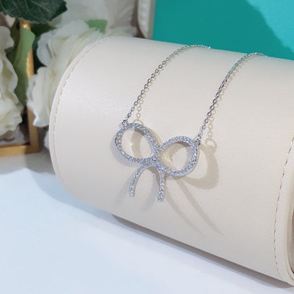 [Hevara Jewelry]CLAW SET RHODIUM PLATED BOW NECKLACE